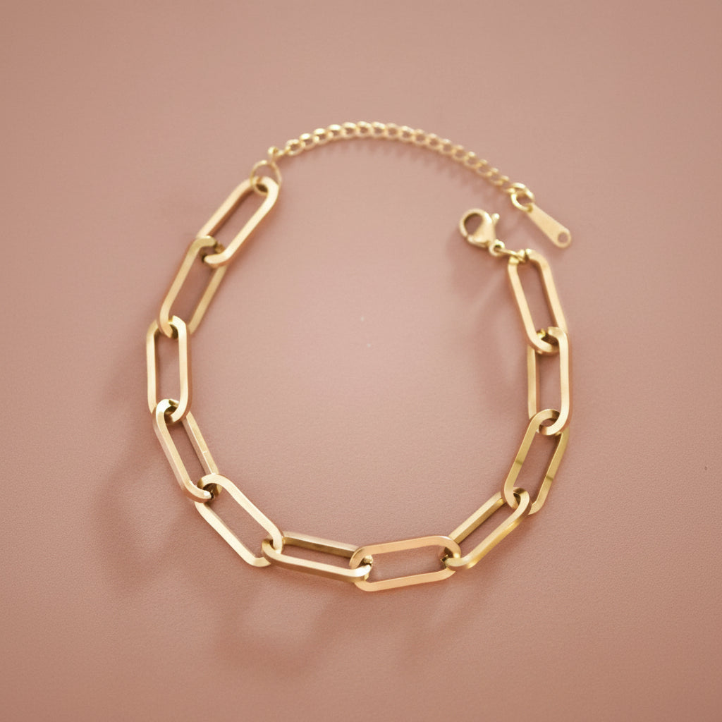 Elevate your everyday style with this stunning 18K gold plated stainless steel chain bracelet. Crafted to be hypoallergenic, waterproof, and tarnish-resistant, it's the perfect companion for any occasion—whether you're layering it with other pieces or wearing it solo. This beautiful bracelet brings warmth and sophistication to your wrist while standing up to daily wear. The durable stainless steel core ensures longevity, while the luxurious gold plating catches the light beautifully. 
