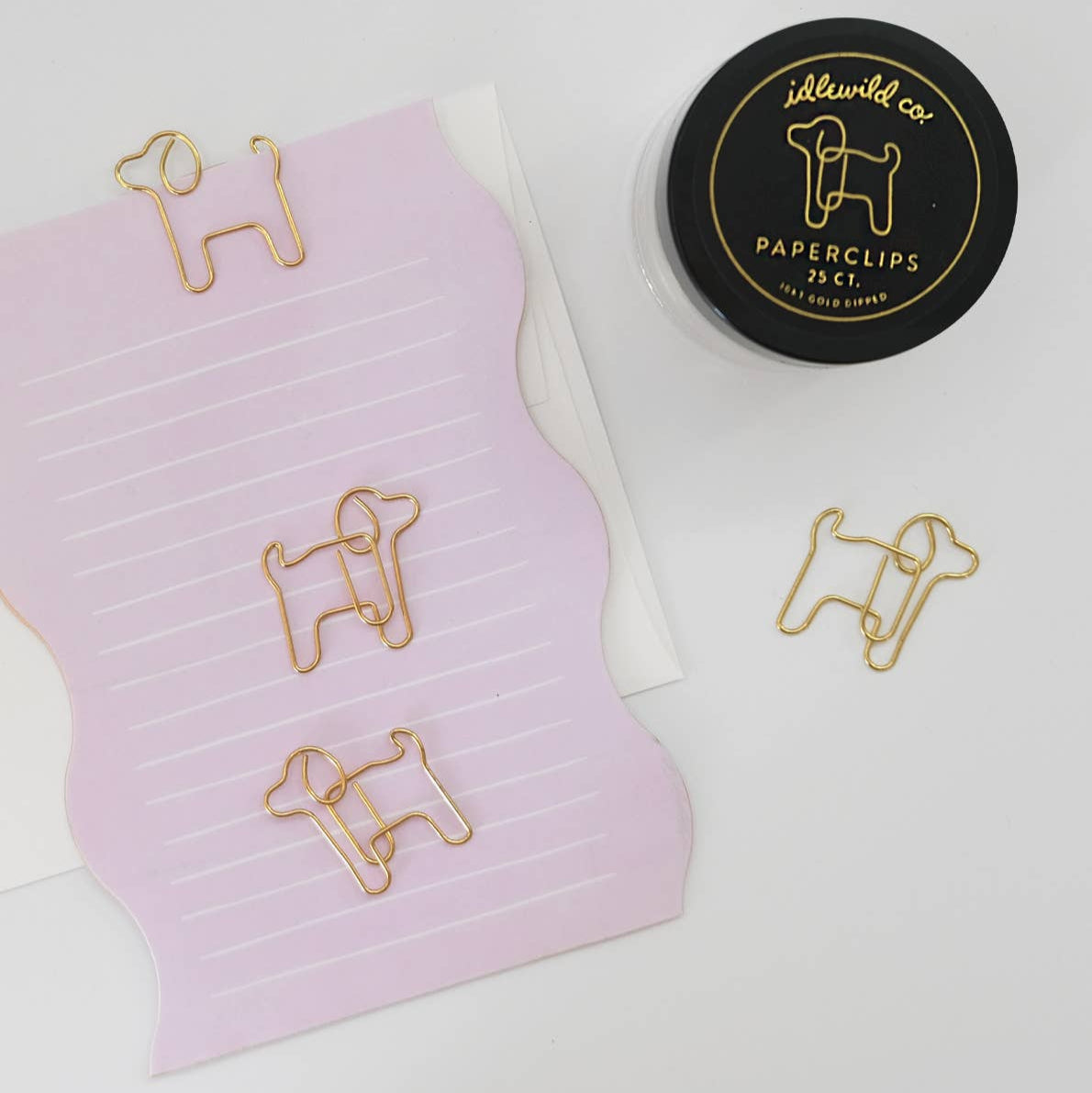 Our fun and quirky paper clips make all of your office &amp; school work just a bit more–if not exciting–than at least more aesthetically pleasing.

Small glass jars are filled with 25 puppy shaped, 10k gold clips to dress up your desk, homework, bills, planners–anything you can think of!

• Glass Jar of 25-pieces

• Clips approximately .75" x 1"