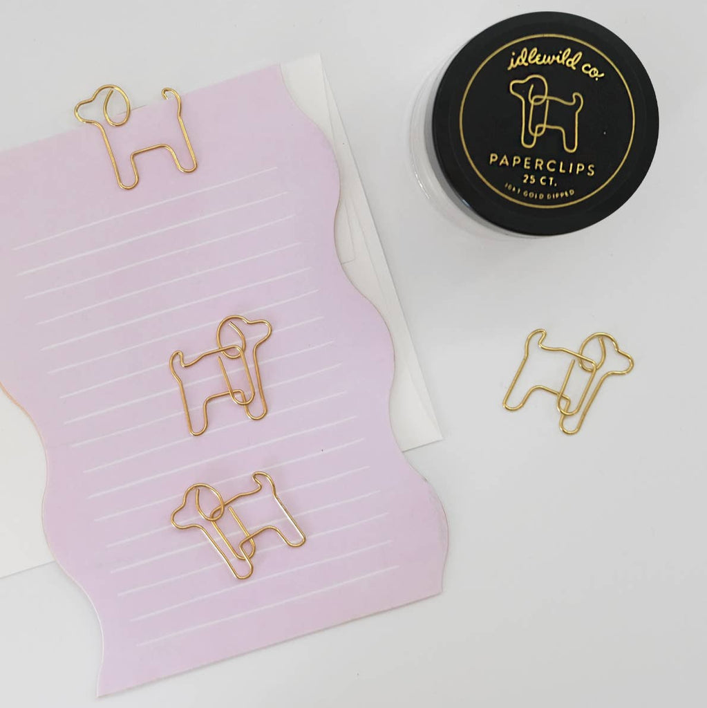 Our fun and quirky paper clips make all of your office &amp; school work just a bit more–if not exciting–than at least more aesthetically pleasing.

Small glass jars are filled with 25 puppy shaped, 10k gold clips to dress up your desk, homework, bills, planners–anything you can think of!

• Glass Jar of 25-pieces

• Clips approximately .75" x 1"