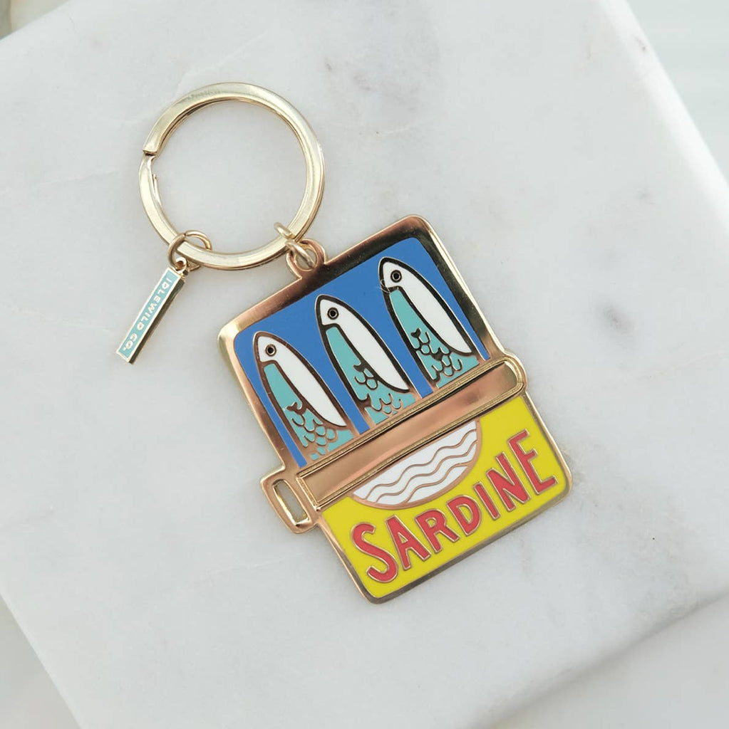 Our brass and enamel keychains make for an eye-catching accessory, perfect for finding those keys at the bottom of your bag! Created from our hand painted designs, they're fabricated with vibrant, hard-enamel and polished to a shine. We offer them in a pretty, plastic-free gift box, or opt in to our unboxed option for a reduced cost.

• Brass and Enamel Keychain

• Charm Measures Approx. 1.75 X 2″