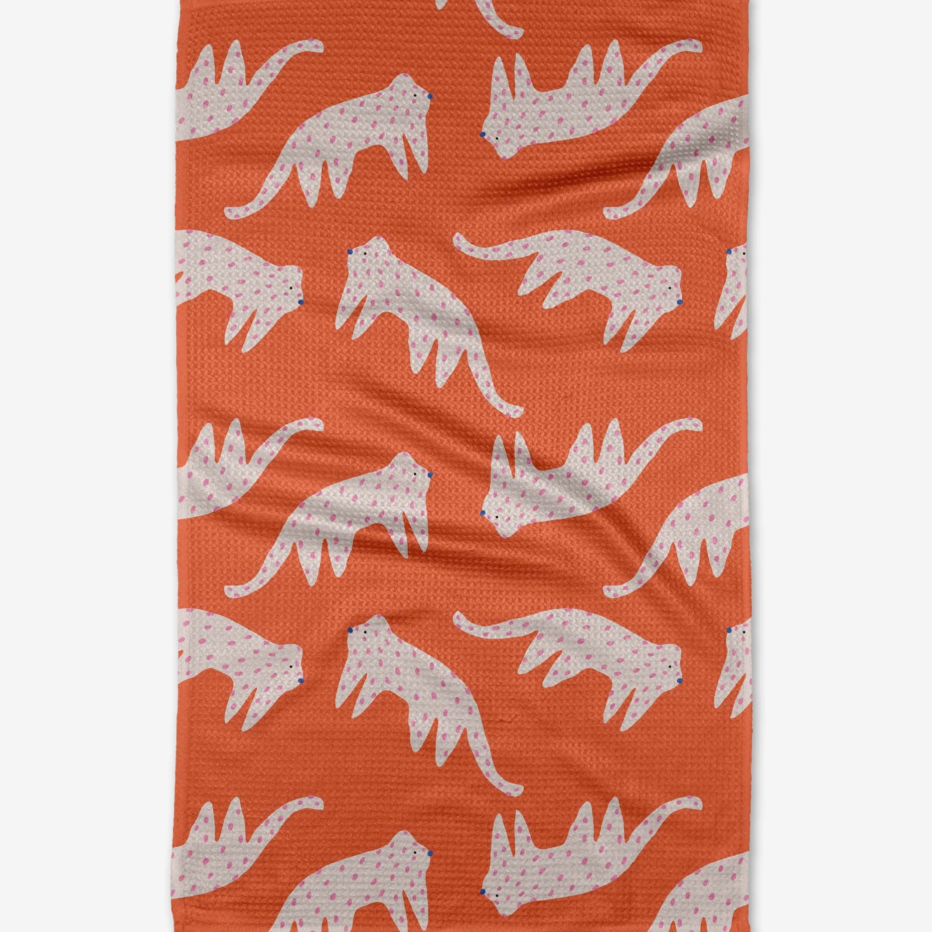 Orange towel with white tiger pattern on a white background