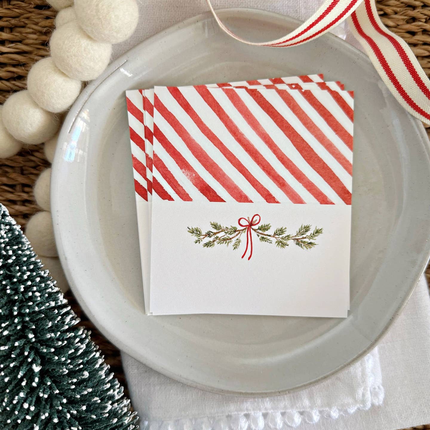 Set a festive table for all your holiday gatherings with charming place cards for each guest. Christmas Bough illustration on the front with red and white stripes on the back.




Details

set of eight place cards
Blank space for name to be written
2" x 3.5" when folded
Printed on 120lb superfine paper

Original watercolor artwork by Emily Lex