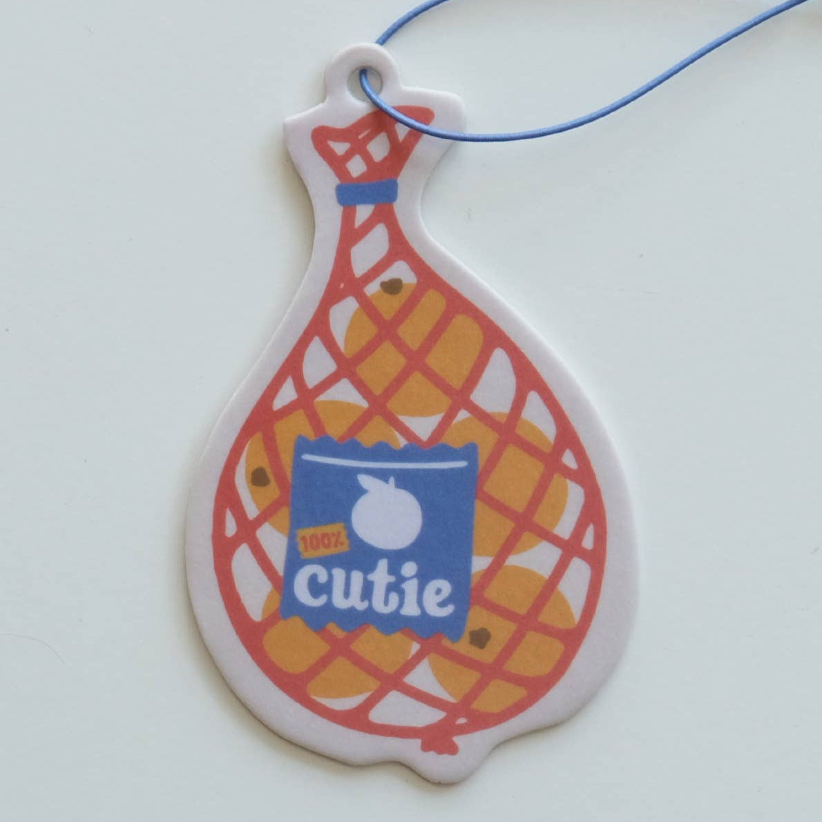 Decorative car air freshener shaped like a tennis racket with 'cutie' branding on a white background