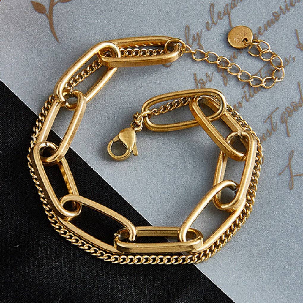 Elevate your everyday style with this beautiful 18K gold plated stainless steel layered chain bracelet—a piece designed to be as dependable as it is stunning. Crafted with care, this bracelet is hypoallergenic, waterproof, and tarnish-resistant, making it perfect for daily wear. Whether you're heading to the office, the gym, or out for an adventure, it moves with you without worry. To keep your bracelet looking radiant, we recommend avoiding prolonged contact with lotions, perfumes, and cleaning products.