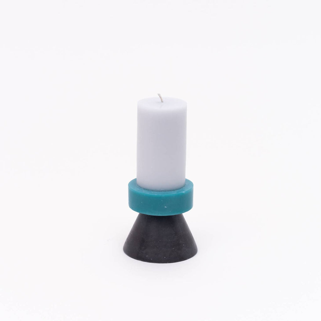 The colors of these stack candles have been carefully chosen to create a playful combination. All of the candles are individually hand poured by skilled fair trade artisans layer by layer to form the multi colored effect.        Color  Lilac / Turquoise / Charcoal      Size  2.8″ x 2.8″ x 5.7″