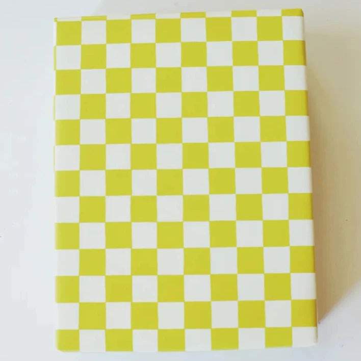 present wrapped with green checkered wrapping paper