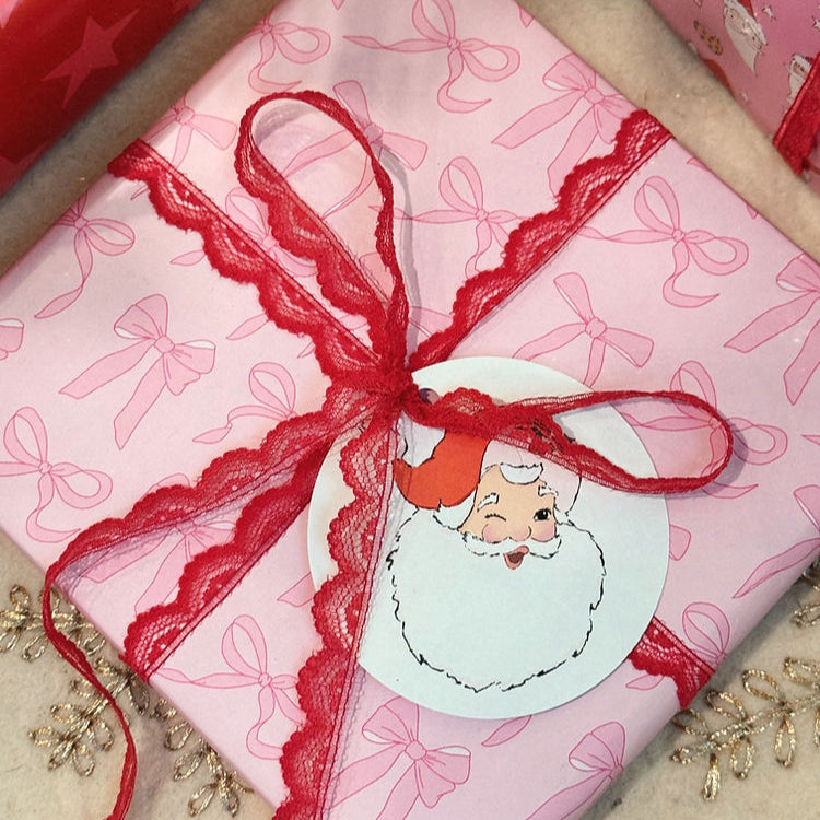 pink wrapping paper with a bunch of different pink bows