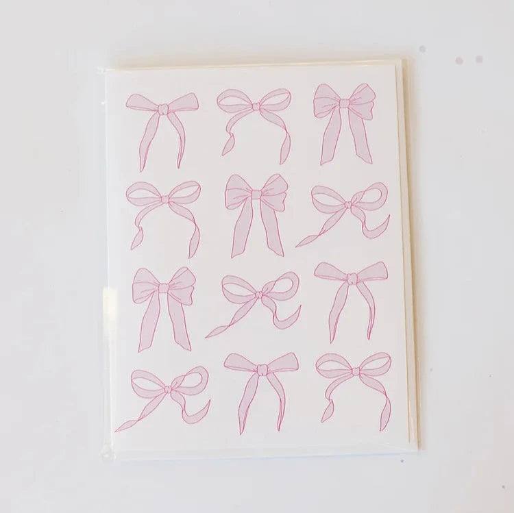 white card with various pink bows