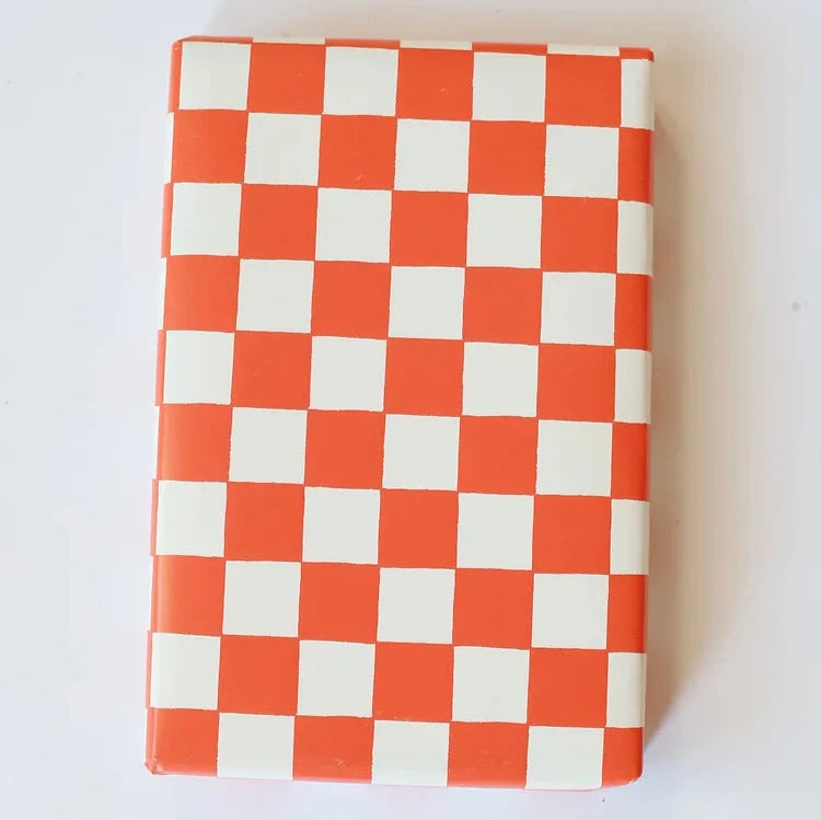 present wrapped with red checkered wrapping paper