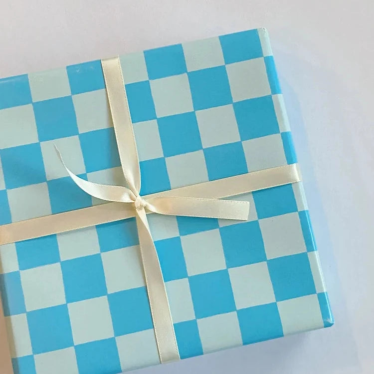 present wrapped with blue checkered wrapping paper