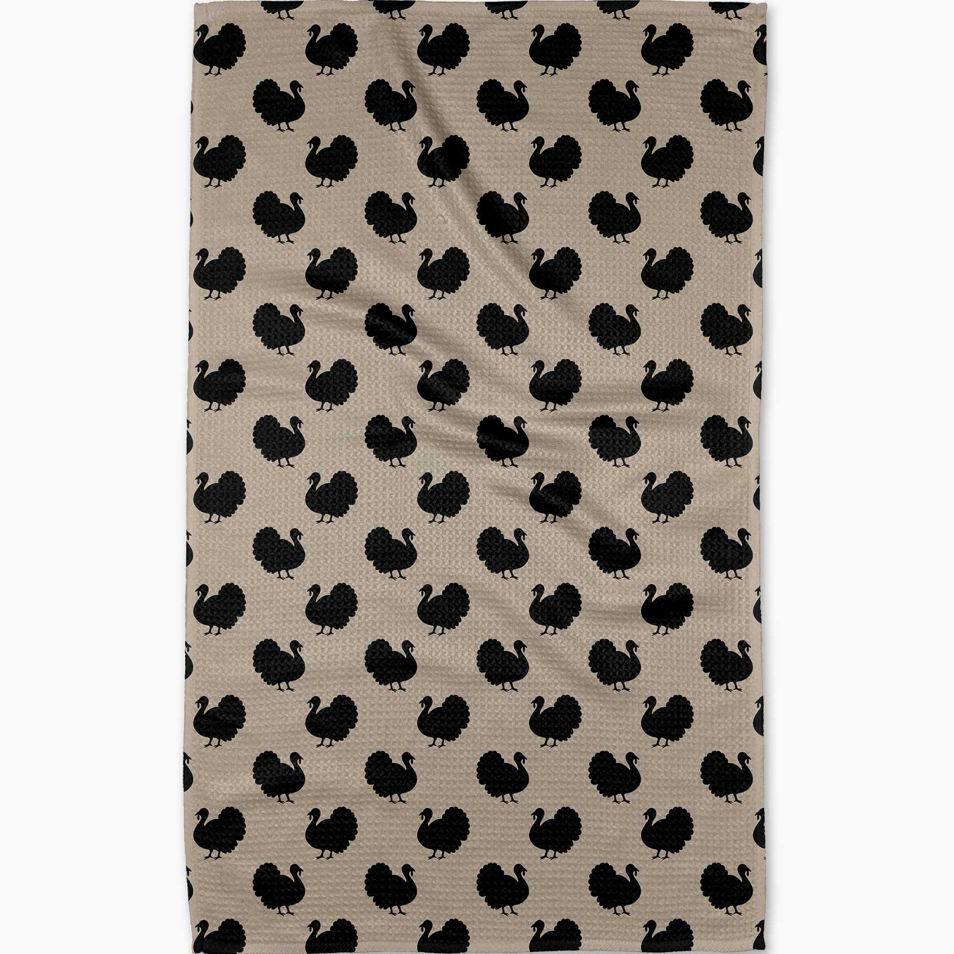 Beige towel with black turkey pattern on a white background