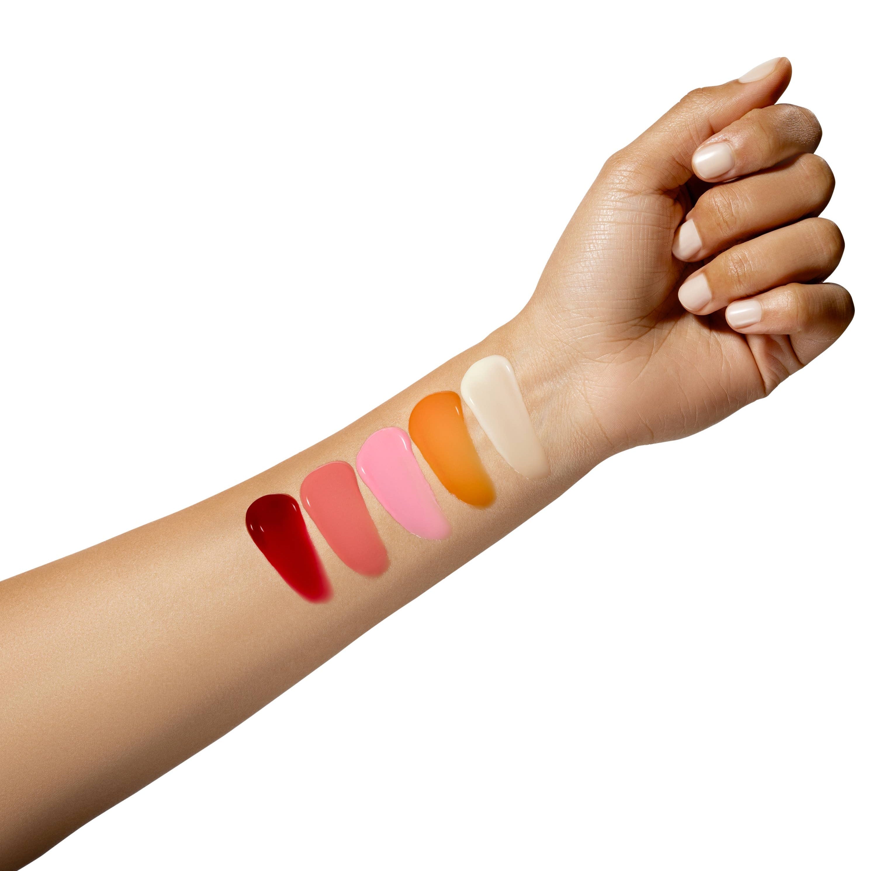 Hand with swatches of lipsticks on a white background