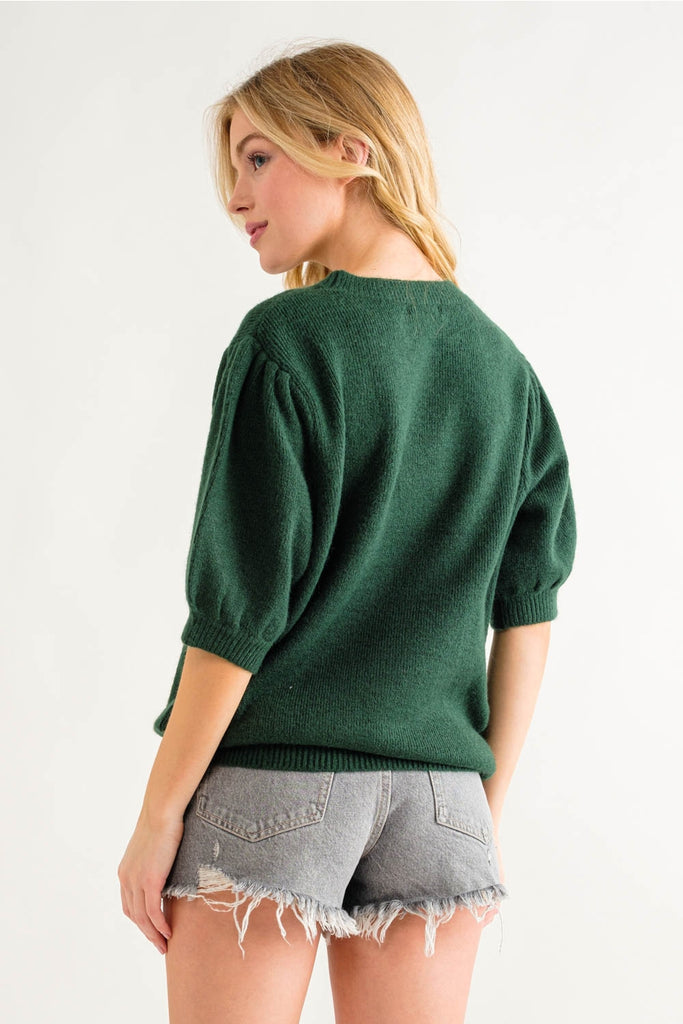 Get cozy, cute and a little bit quirky with this Green Puff Sleeve Cropped Sweater. The unique puff sleeves add a fun twist to this classic cropped style, making it a must-have for your wardrobe. Perfect for layering or wearing solo, this sweater is bound to become your new go-to piece.