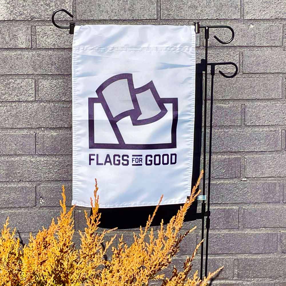 Hang your new Flags For Good garden flag (it works with others too) with this perfect garden flag holder! Easily slip the pole through the pole pocket along the top of the flag and keep it in place with the two included cinch holders. For added security against wind making your garden flag wrap up, use the included clip to attach the bottom of the flag to the vertical pole and make sure the flag is always readable!