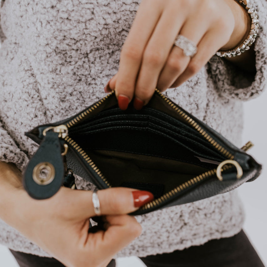 The Uptown Messenger Purse is perfection in a handbag! This versatile piece can be used as an adjustable cross-body bag, wristlet, or a simple wallet, making it the perfect finishing touch to any night out. A zippered top and rotating clasp closure are timeless elements that will make this the most functional purse you'll ever own!