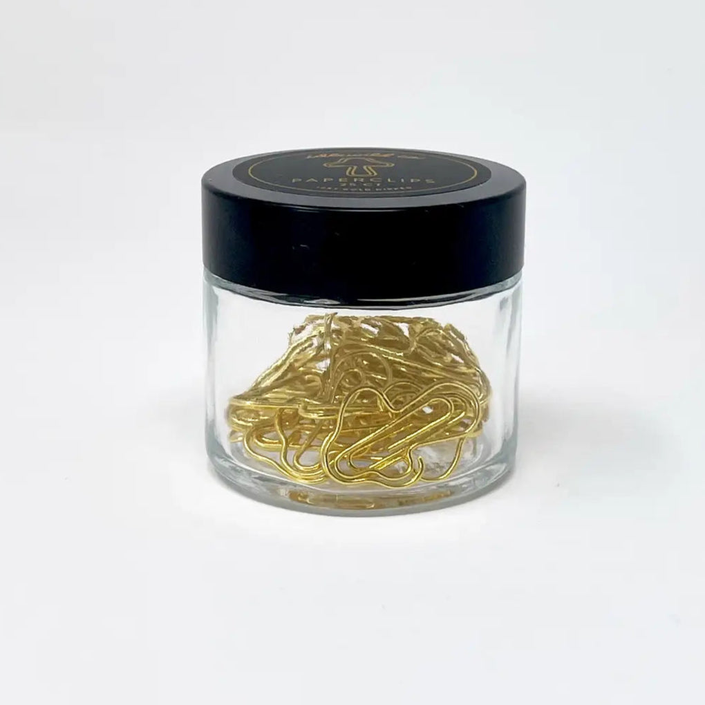Our fun and quirky paper clips make all of your office &amp; school work just a bit more–if not exciting–than at least more aesthetically pleasing.

Small glass jars are filled with 25 mushroom shaped, 10k gold clips to dress up your desk, homework, bills, planners–anything you can think of!

• Glass Jar of 25-pieces

• Clips approximately .75" x 1"