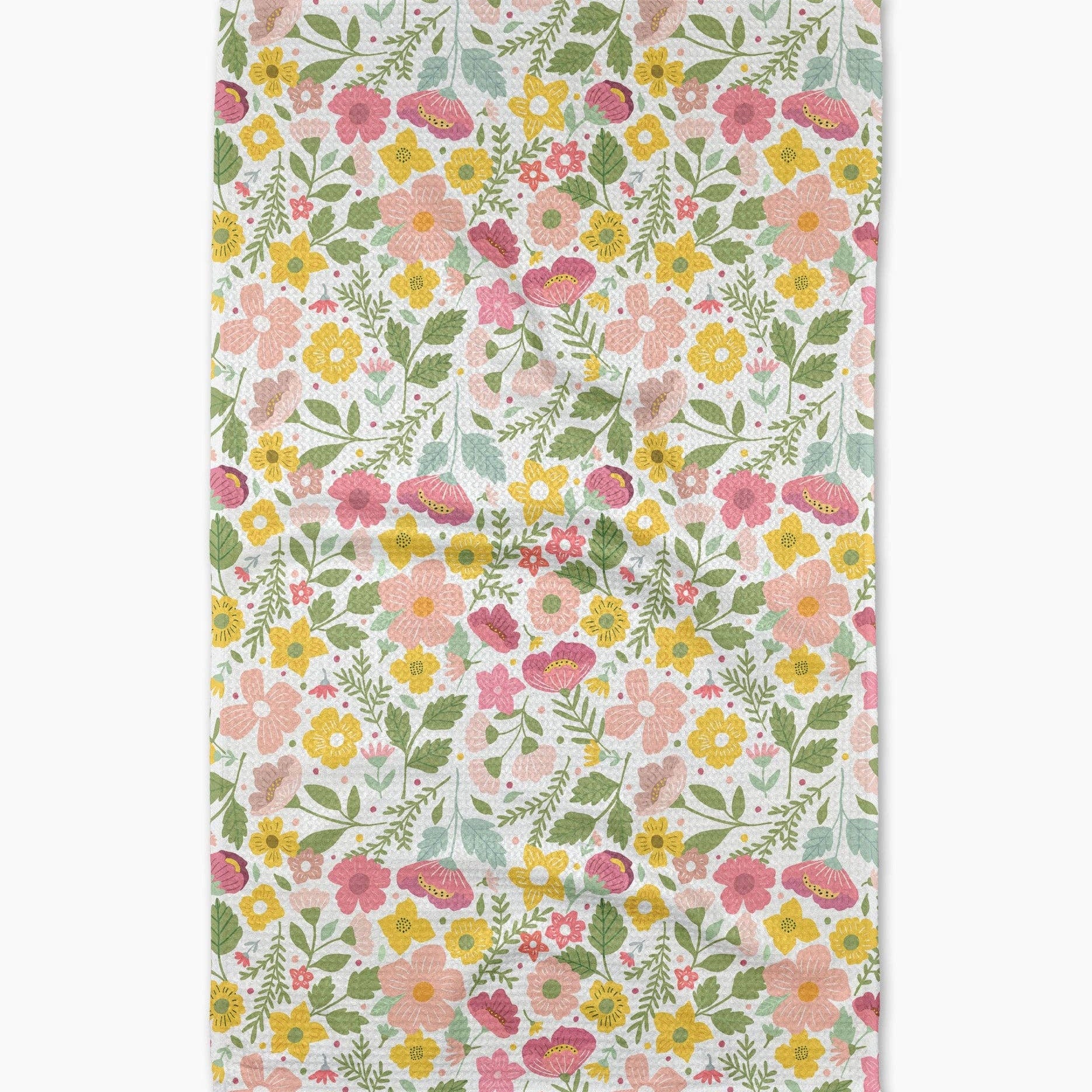 Floral patterned tea towel on a white background