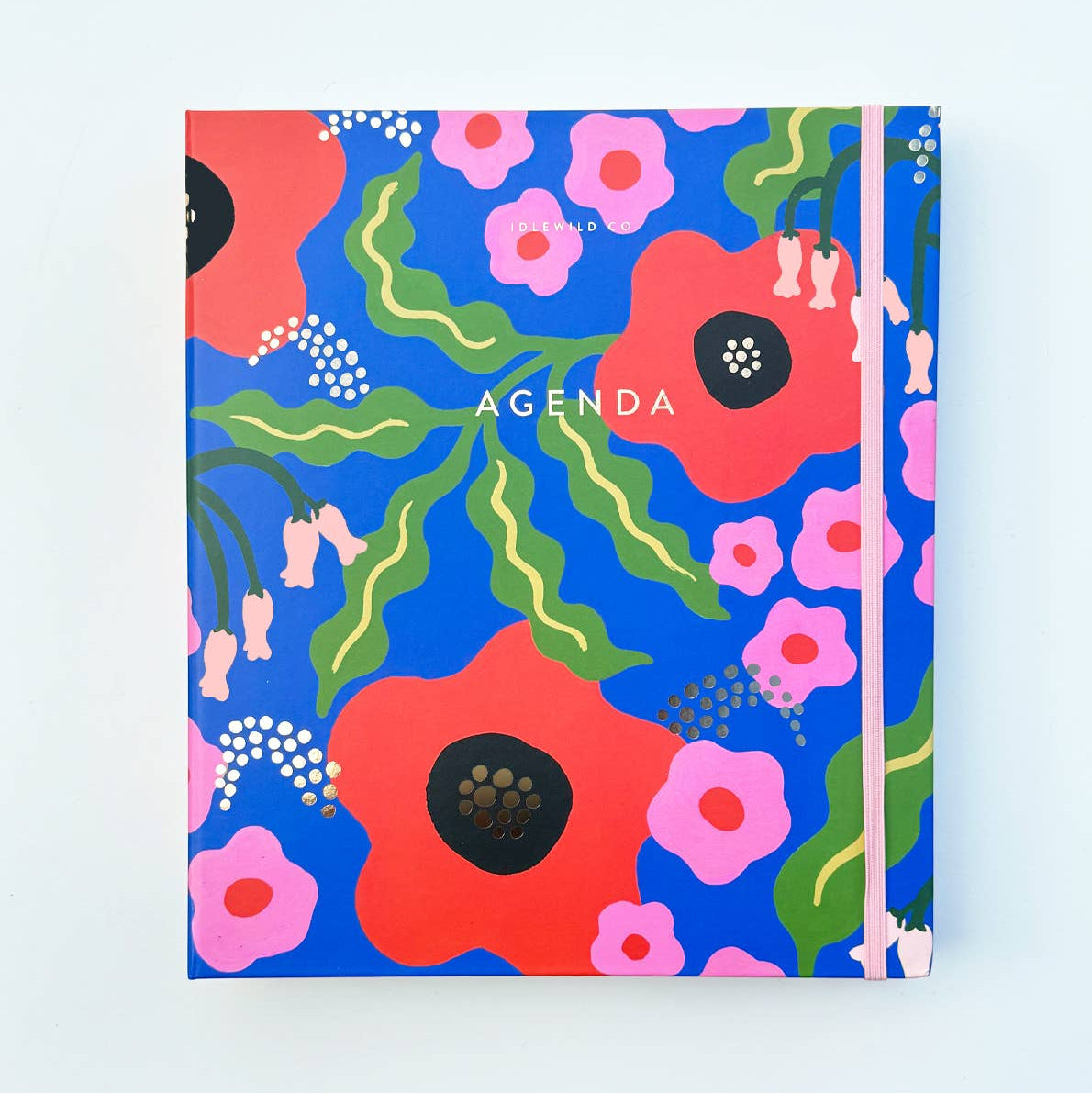 Floral notebook with 'AGENDA' text on a light blue background