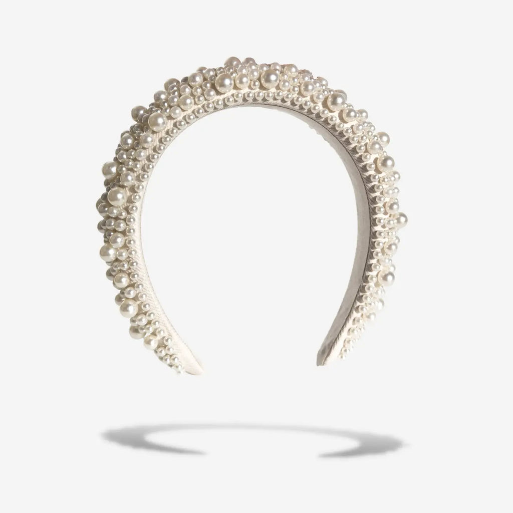 Add a touch of glamour to your look with our stunning pearled headband, meticulously hand-crafted with a range of different-sized pearls that exude a touch of classy elegance. We wanted to bring a new line of high-quality hair accessories to bring a luxury feeling to your customers. Whether dressing up for a special occasion or adding a chic accent to your everyday style, this headband is the perfect choice. Indulge yourself with this stunning headband that we adore so much.