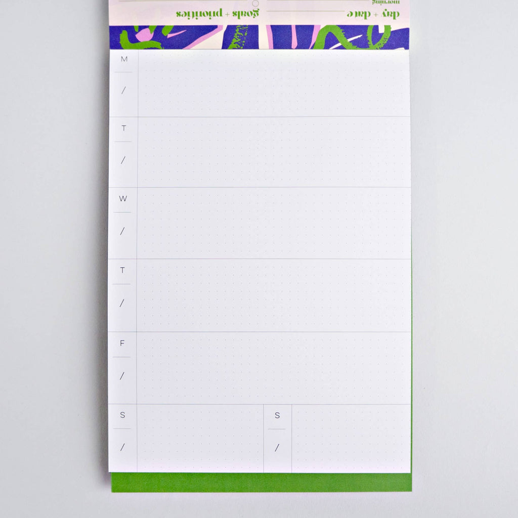 This A5 size (5.83 in x 8.27 in) pad has approx. 50 pages, has a wrap around cover and is printed on FSC certified paper using vegetable inks and has recycled cardboard backing. The pages are 115gsm and the cover is 300gsm, and each page features a weekly planner page on the reverse so you can make the most of your pad. Made in the UK.