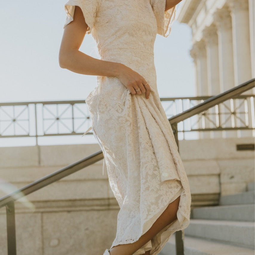 This one is going to sweep you off your feet. Featuring a sweetheart neckline, flutter sleeve, and flattering a-line silhouette. The embroidered floral overlay is a subtle yet captivating final touch to this timeless piece. This is one you will wear time and time again. Your holiday parties and special events won't know what hit them.