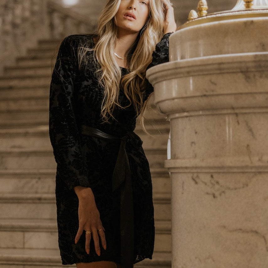 Evoking timeless style paired with classic glamour, the Genevive is also enhanced with a modern touch. Adorned with a velvet, paisley overlay, and a silky bow, this square neck mini dress&nbsp;offers all the style you need&nbsp;for cocktail parties to holiday parties. Add your favorite clutch and sparkly accessories to complete your feminine looks.&nbsp;