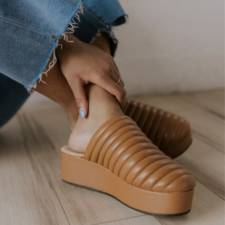 Our first thought for this shoe was 'foot couch' and here's why: quilted toe, platform design, + comfy footbed. It screams 'couch' for all the right reasons. This mule is basic but elevated. But be warned—it’s the kind of shoe that has people chasing you down the street to ask where you got it. And she pairs effortlessly with all your favorite looks from denim to dresses