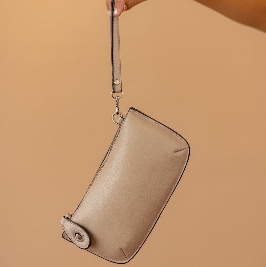 The Uptown Messenger Purse is perfection in a handbag! This versatile piece can be used as an adjustable cross-body bag, wristlet, or a simple wallet, making it the perfect finishing touch to any night out. A zippered top and rotating clasp closure are timeless elements that will make this the most functional purse you'll ever own!