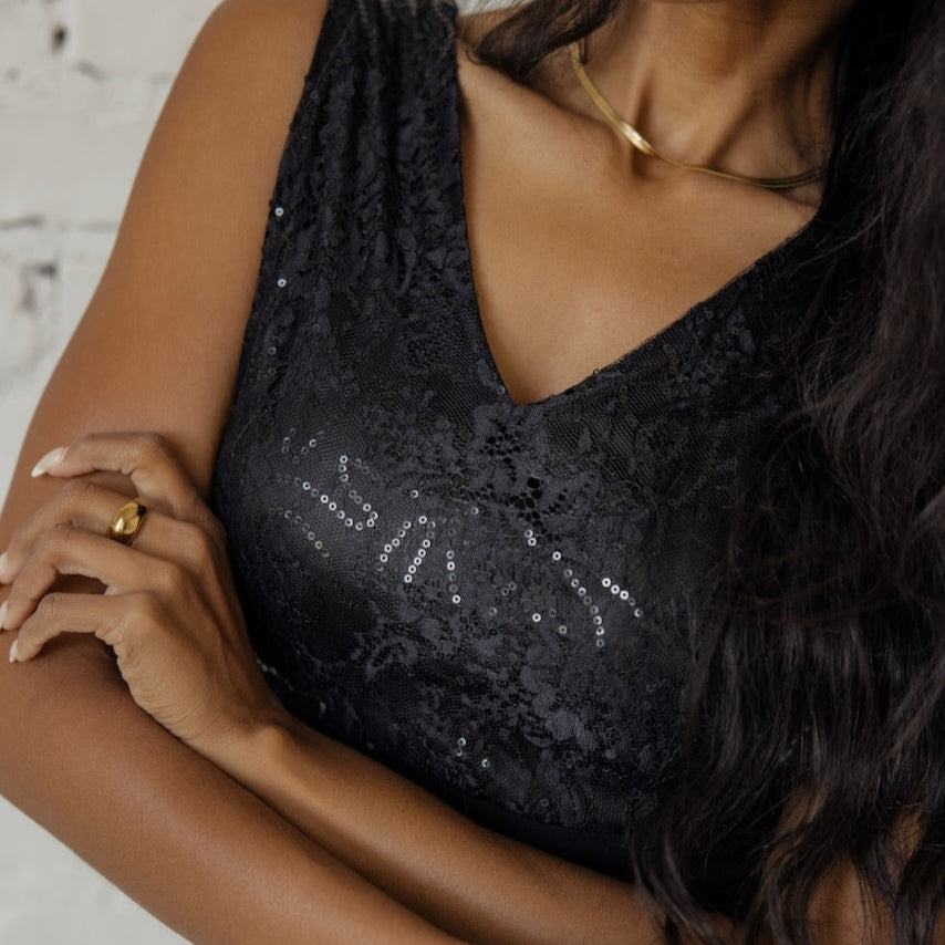 A world class choice when in evening wear, the Gala Timeless Sequin Detail Dress is a needed addition to any woman's formalwear repertoire. With a stunning v-neck pathing a way to a lace + sequin bodice, this dress will take any breathe away. This timeless piece also exhibits a slim silhouette created by back and front darts, a flirty leg slit, and a hidden back zipper. So, what gala are you attending tonight?