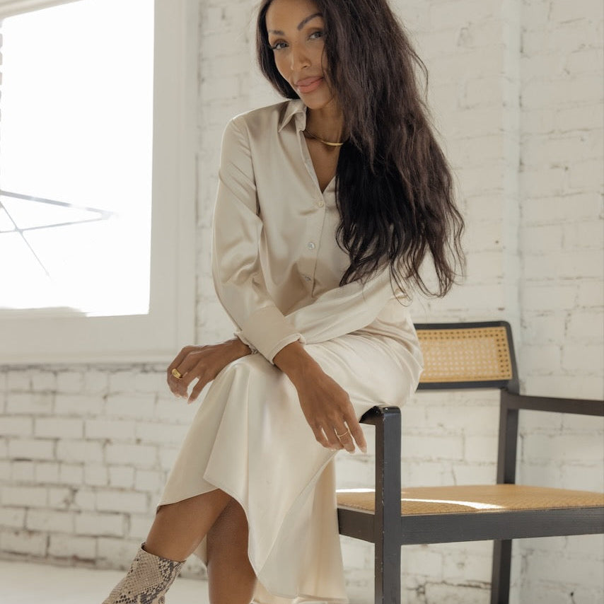 Emerge the goddess from within with the Gable Estates Button Up Blouse. Featuring working iridescent buttons and silky material, it will be your armor to conquer your holiday parties, days in the office, or just getting through the day. 