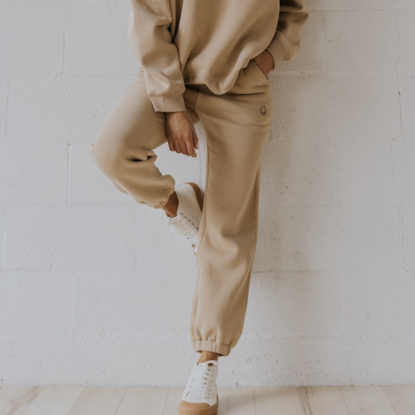 We got nothing but smiles here at ROOLEE :) These soft, french terry sweatpants feature an embroidered smiley face graphic, elastic waistband, + working pockets. 
