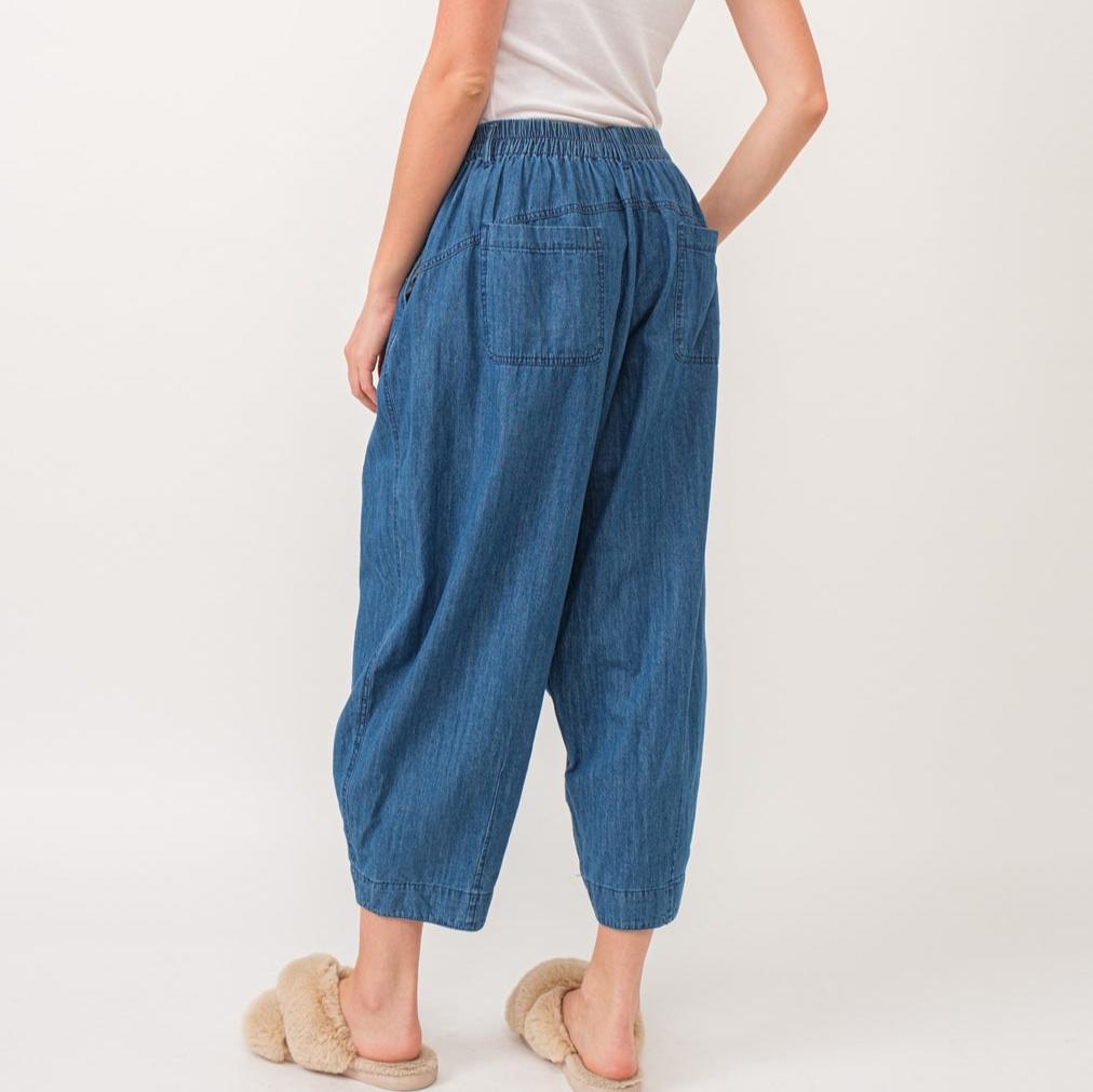 Quinn Pants are crafted from lightweight denim, offering a relaxed fit with a pleated front detail for added flair. The elastic back waist ensures comfort without compromising style.