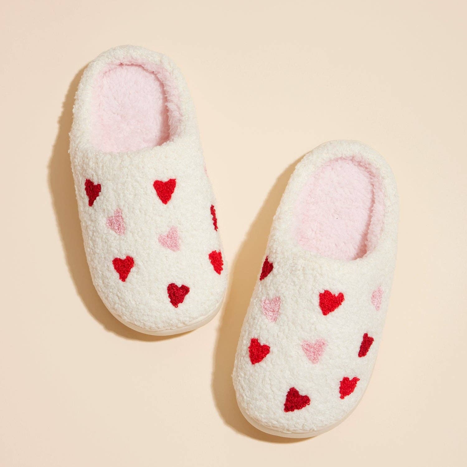 Step into warmth and charm with our Multi Hearts Home Slippers. Adorned with a playful heart pattern, these ultra-soft slippers are perfect for keeping little feet cozy at home. A sweet and thoughtful gift for loved ones—or a cozy treat just for them.

Details:

Size Guide:
US 7/8: Toddler Ages 3–4
US 9/10: Toddler Ages 5–6
US 11/12: Little Kids Ages 7–8
Upper: 100% Polyester / Sole: 100% EVA