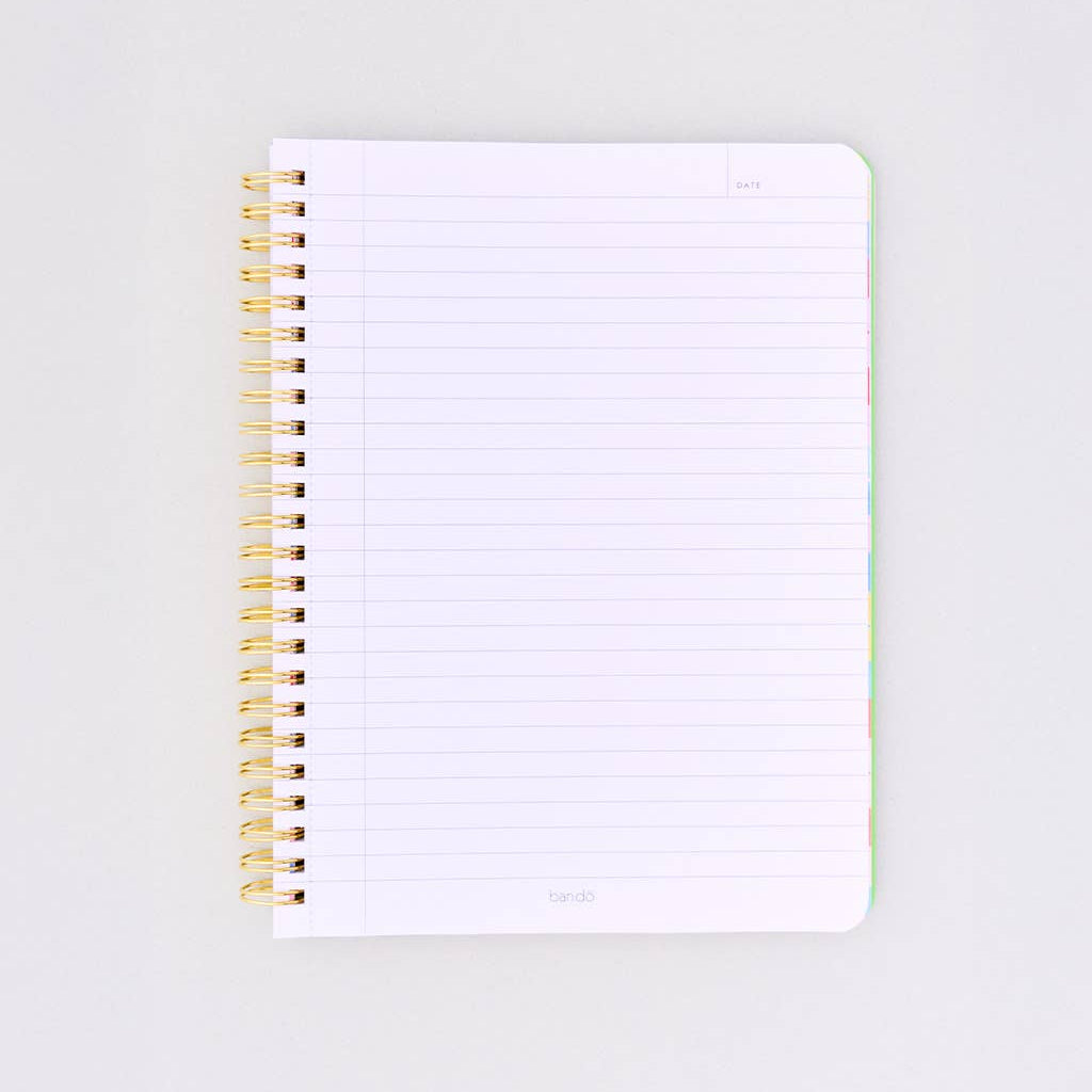 Open spiral-bound notebook with white pages on a light gray background