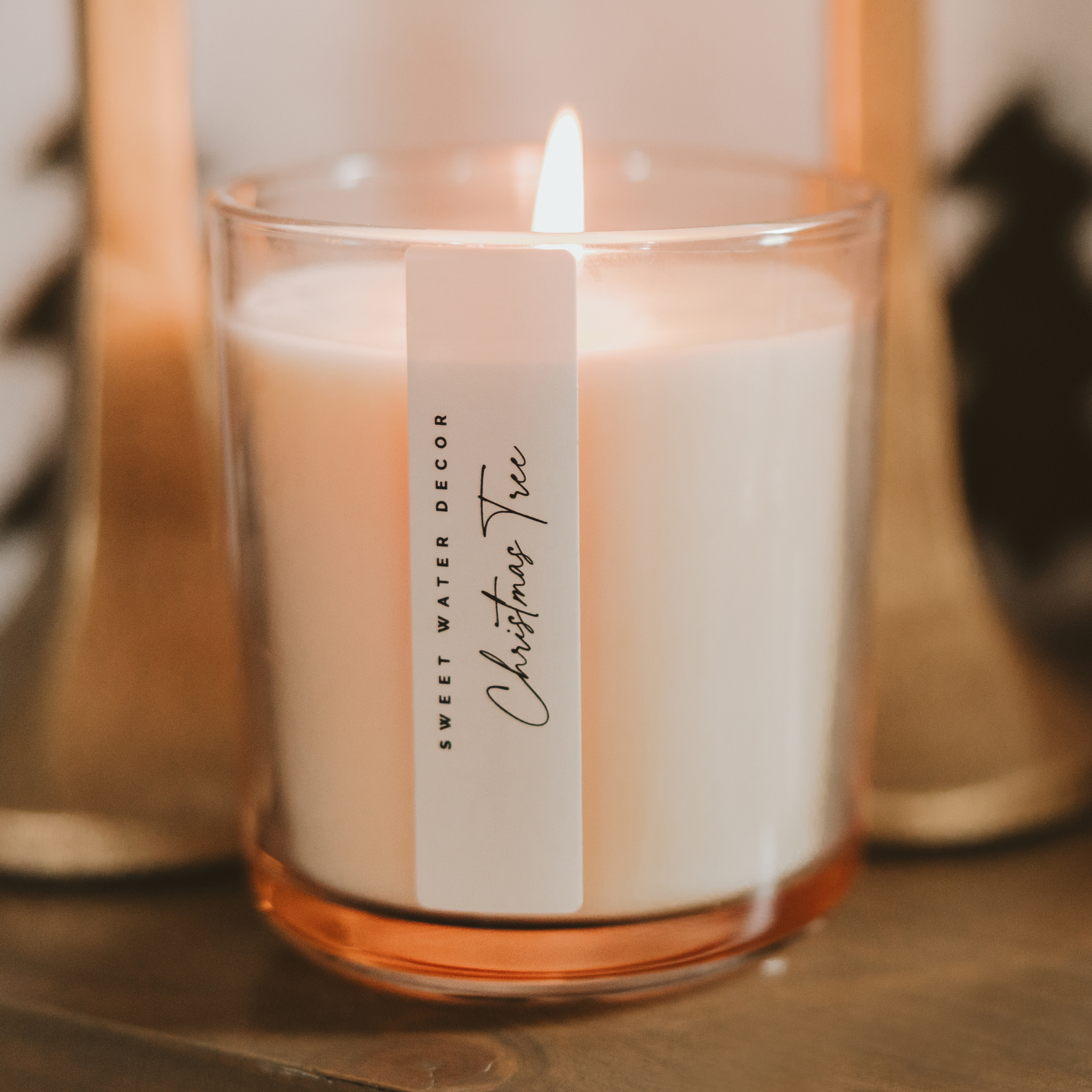 Our Christmas Tree fragrance brings the crisp, nostalgic scent of a tree farm indoors with notes of pine needles, cedarwood, cypress, and evergreen. Presented in an elegant tinted glass jar, its classic design fits effortlessly into any holiday decor. Perfect for holiday candle collections, seasonal displays, and thoughtful stocking stuffers that bring warmth and cheer to every home.