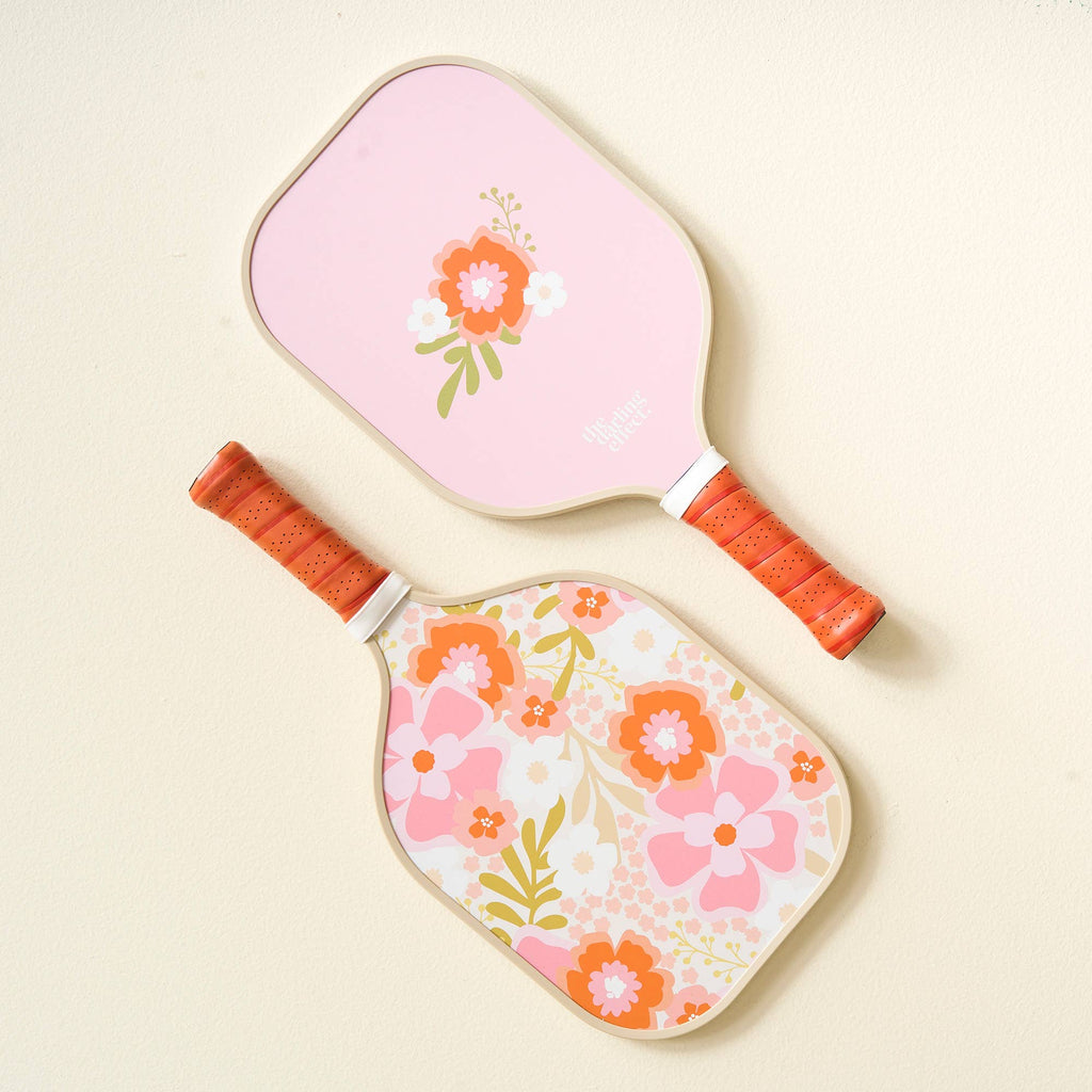 Are you ready to elevate your pickleball game and turn heads on the court? Look no further! Our top-quality pickleball paddles are here to make your pickleball experience truly exceptional. Our top-notch paddles combine fun and femininity, offering a unique look that sets you apart from the competition. Play with passion and style – it's what we're all about.