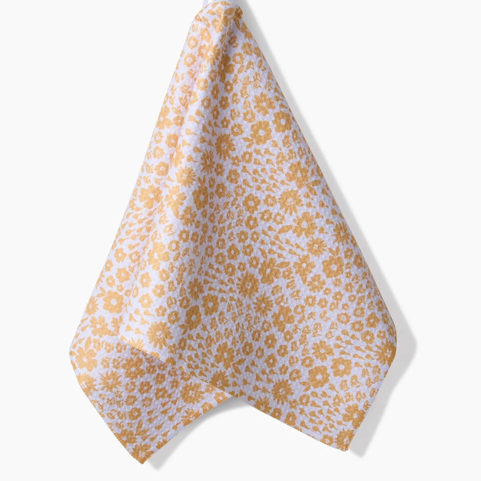 Yellow floral patterned towel hanging on a black hook against a white background Tea Towel