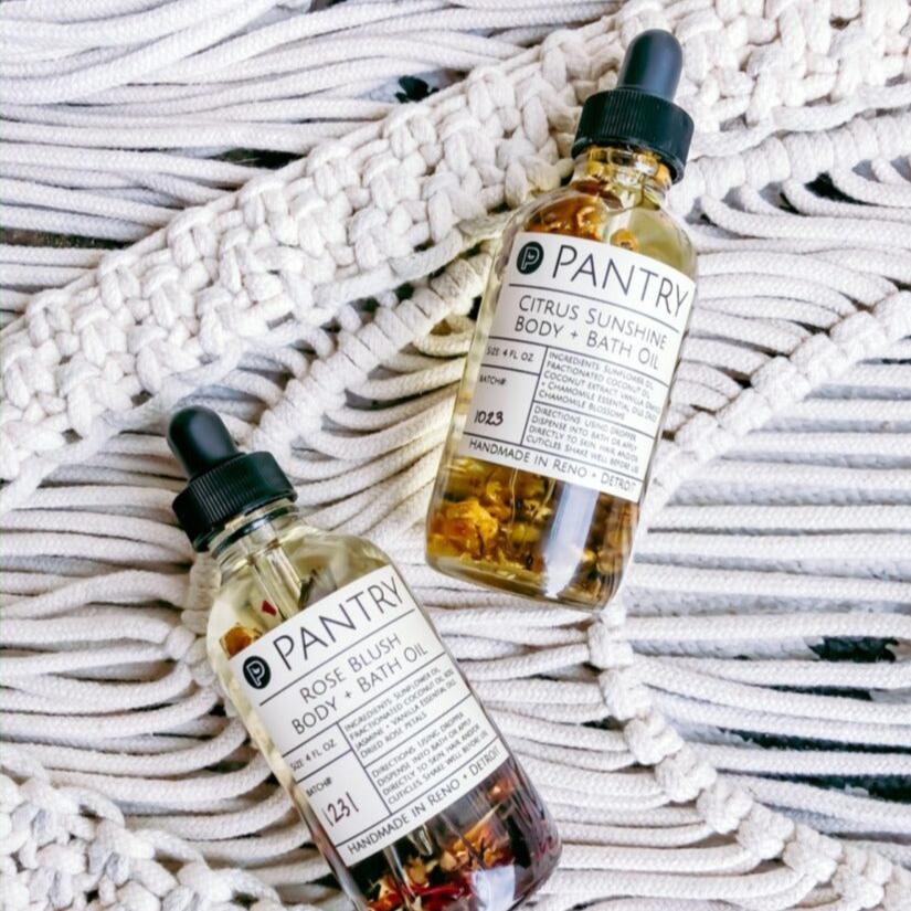 4 fl oz bottles of citrus sunshine and rose blush body + bath oil