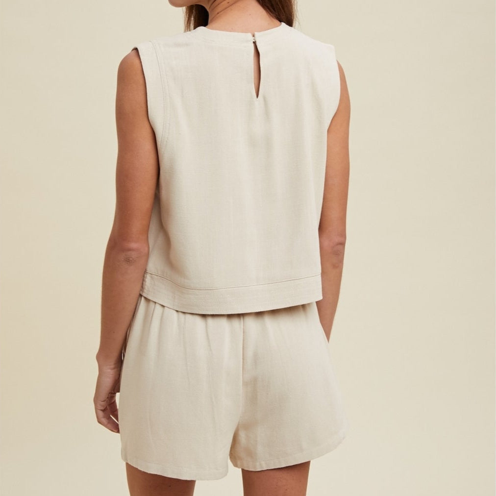 Stay comfortable and stylish in our Linen Tank Top and Shorts Set. Made with natural linen, this set offers a lightweight and breathable option for warmer days. The tank top and shorts provide a flattering and versatile combination that can be dressed up or down for any occasion. Perfect for effortless summer style.