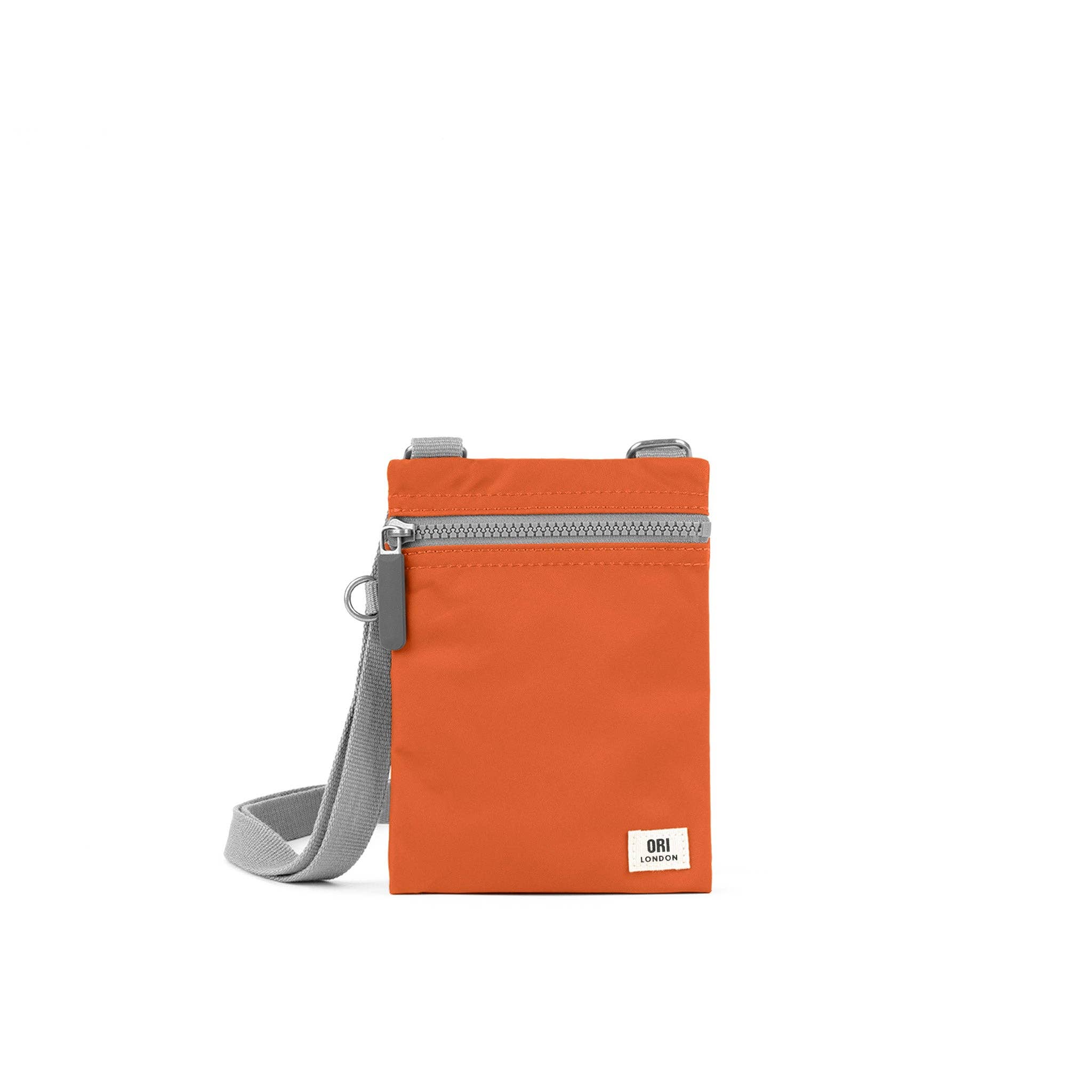Our hands-free extra pocket is always by your side. The Chelsea is our great little crossbody pocket to keep those special things close and safe. Burnt Orange

Give your phone, card and essentials their very own stylish way to be carried whilst you are on the move. Our brand-new Chelsea collection is the perfect lightweight, urban accessory for you to travel light and always be on the move.

Made from recycled material, the Chelsea has been designed to keep your mobile phone, cards, and valuables close by.