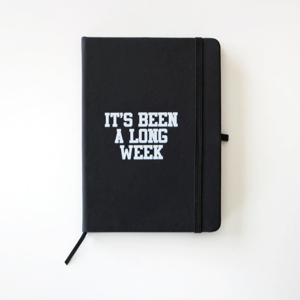 black journal reading "It's been a long week" in a white font