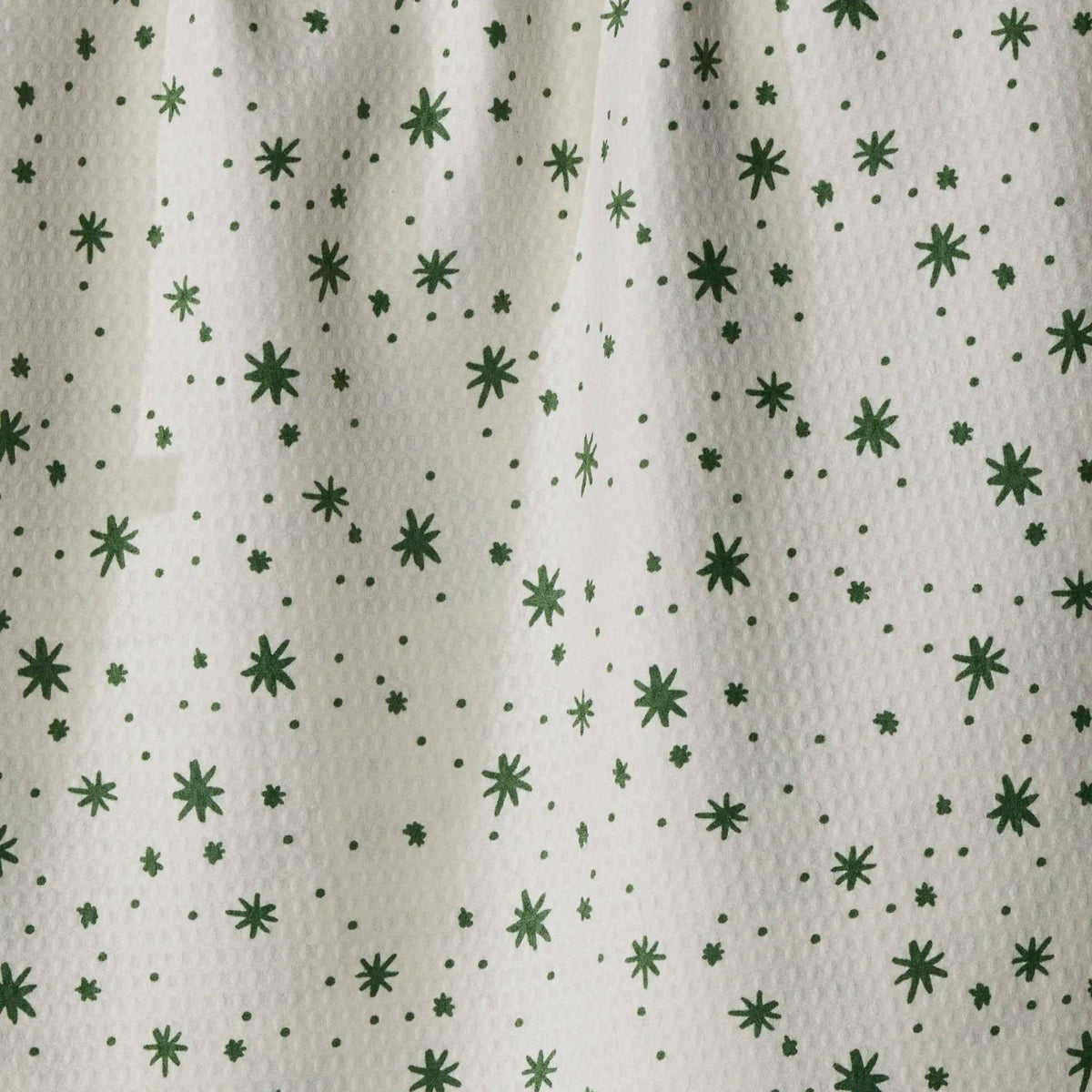white tea towel with green stars