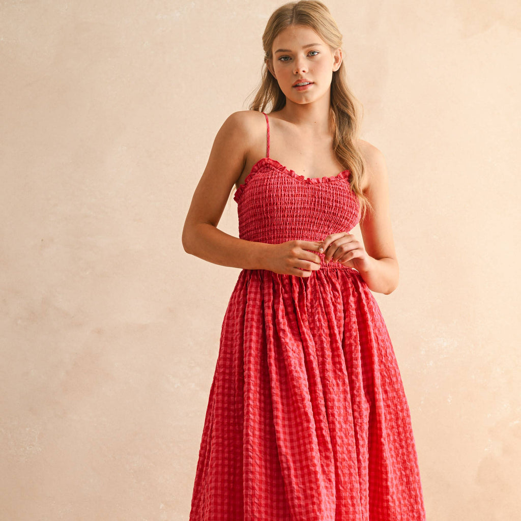 This red gingham print long dress offers a timeless, flattering silhouette perfect for any occasion. Its lightweight fabric ensures comfort throughout the day, while the classic pattern adds a touch of charm to your wardrobe. Designed to make you feel confident and stylish, this dress is an easy choice for casual outings or special events.