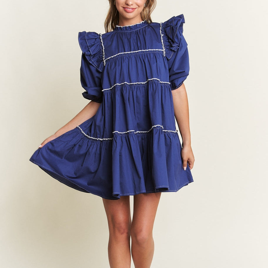 Rock the boat in this Navy Baby Doll Mini Dress with large sleeves, bold navy blue color, and eye-catching white line detailing. Perfect for a flirty and fun look, this mini dress is sure to make a statement. Let your playful side shine through with this quirky and stylish piece!