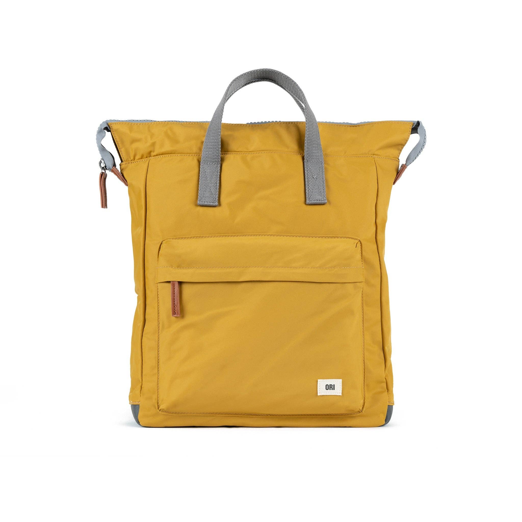 The Bantry is the first, original backpack Ori created with a chunky zip and wide mouth.

Each Bantry can be carried comfortably on your back or by your side with the hand straps. The Bantry features a front pocket closed by a sturdy zip, a secure inside pocket, and a laptop/tablet sleeve inside. Backpack is yellow