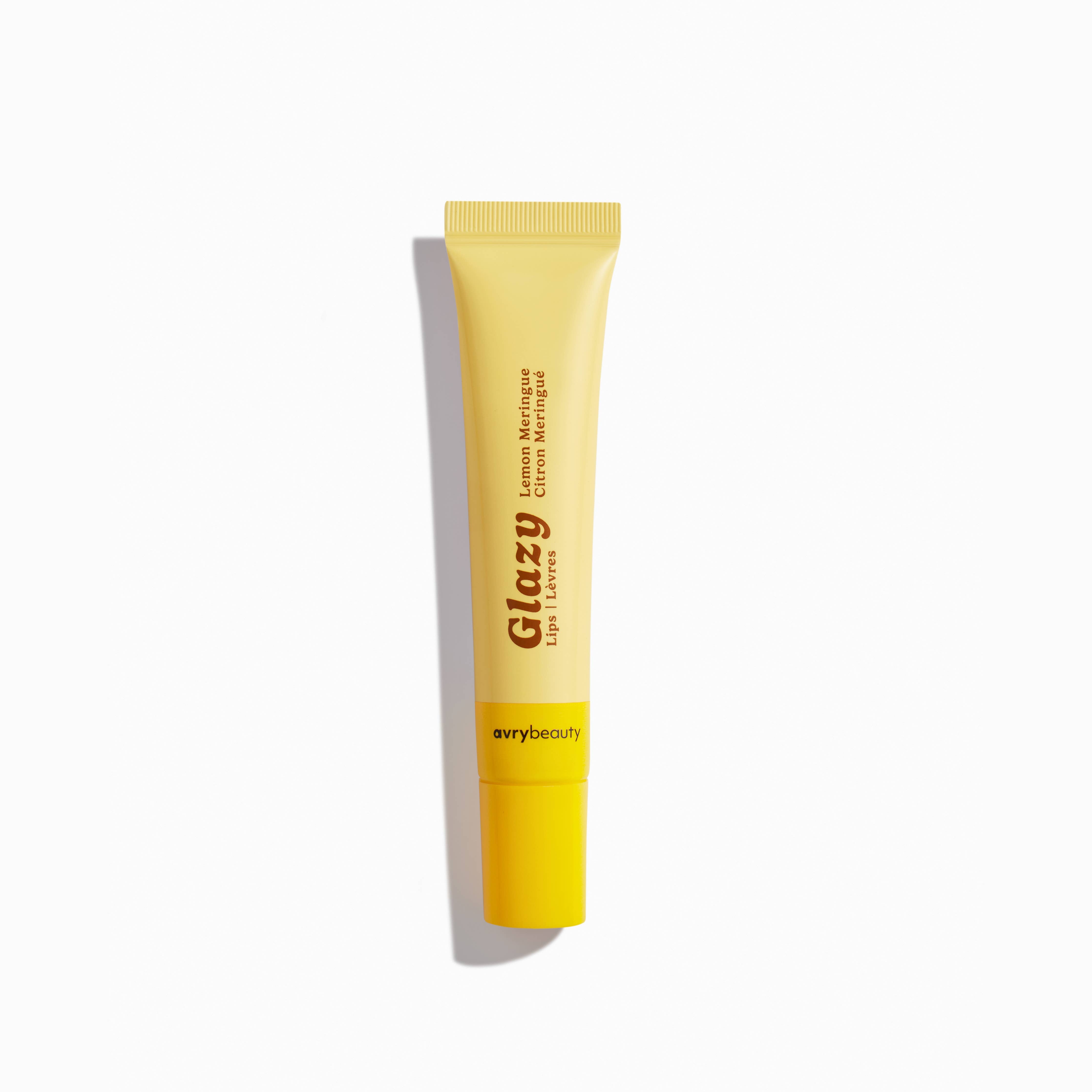 Yellow tube of Glazy lip balm on a white background