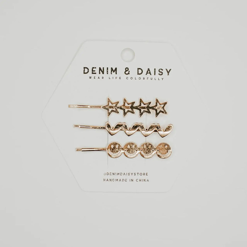 Why settle for boring, old bobby pins, when you could have these True JOY Bobbies from Denim &amp; Daisy! Three gold bobbies Light years better than your everyday, ordinary bobby pins Find these bobby pins only at Denim &amp; Daisy These gold-colored bobby pins feature cute hearts, stars, and smiley faces, taking a normally ordinary, mundane hair accessory to the next level. You’ll only find the True JOY Bobbies at Denim &amp; Daisy. Order yours today.