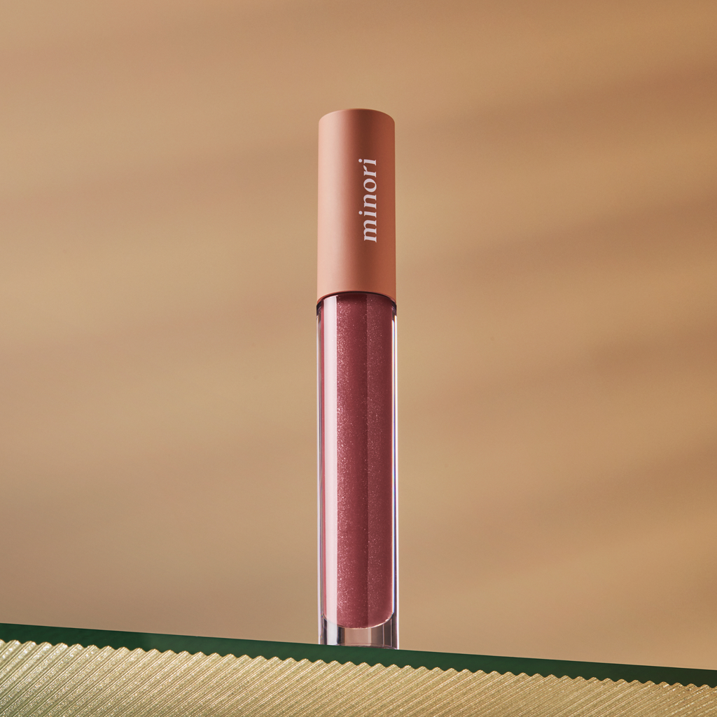 Our vegan Lip Gloss is ultra-moisturizing thanks to Shea Butter, Jojoba Seed Oil, and Vitamine E. Feels like a lip oil or a lip balm because of its smooth buttery texture that enhances your natural lip color, completing your everyday makeup routine. Not sticky at all!  Juneberry shade is a perfect berry mauve, slightly darker than your natural lip color. This is our best-selling shade! Sheer color for a "your lips but better" look. 