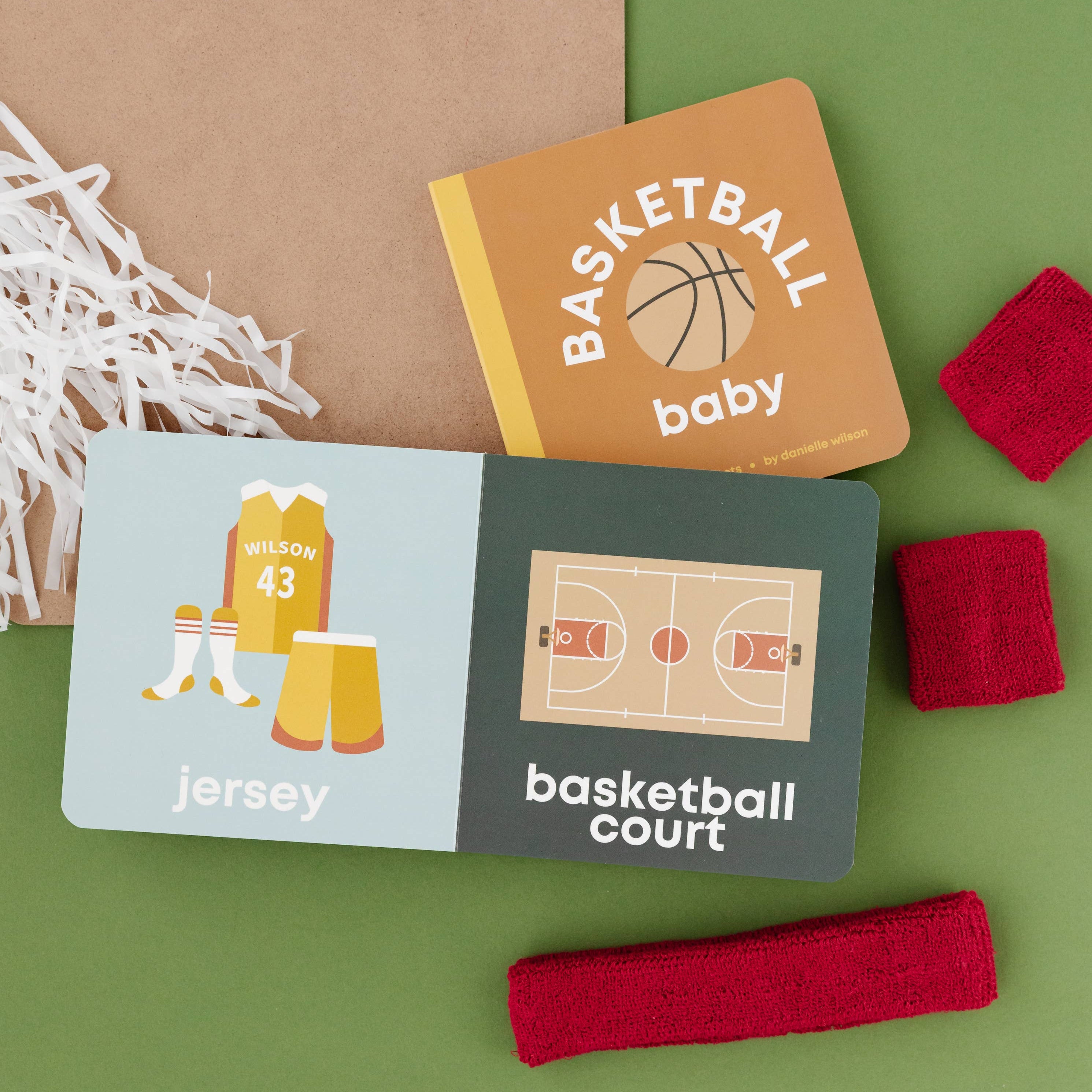 Educational cards about basketball on a green background with a clipboard and basketball-themed items.