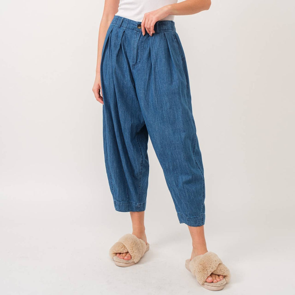 Quinn Pants are crafted from lightweight denim, offering a relaxed fit with a pleated front detail for added flair. The elastic back waist ensures comfort without compromising style.